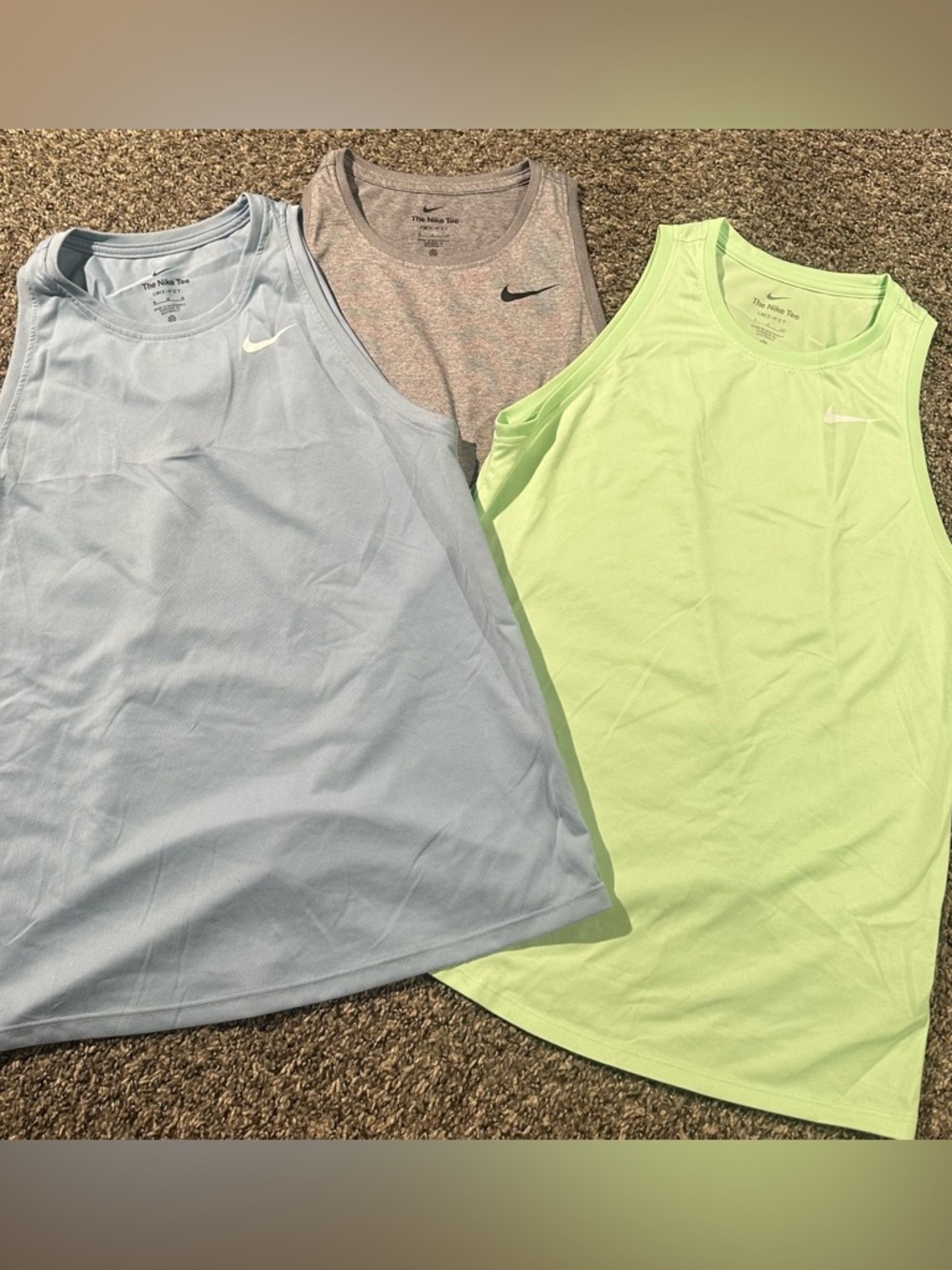 3 Pre-Owned Nike Dri-Fit tank tops.